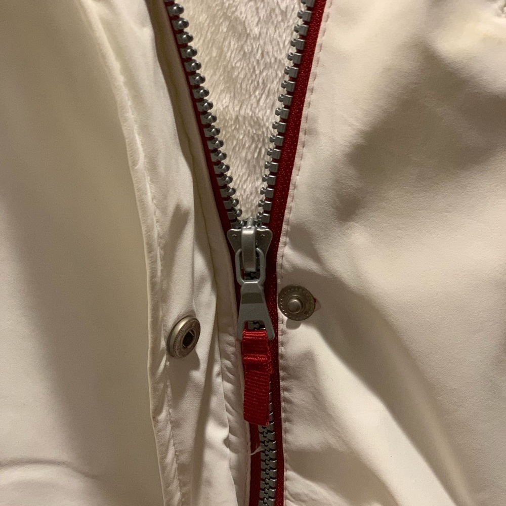 White, Weatherproof jacket with hood and faux fur lining.